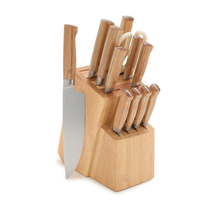 The GreenPan Elite Light Pakka Wood Cutlery Knife Block Set features kitchen knives with light brown handles, stainless steel blades, kitchen shears, and a prominently placed chef’s knife for easy access.