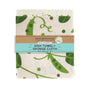 The Neighborgoods Dish Towel + Sponge Cloth - Peas on Earth set features a green pea pod and leaf pattern, packaged with a brown and blue paper band.