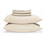 Two large beige pillows are stacked with the Naturepedic Percale Sheet Set—GOTS Certified Organic Cotton—neatly folded on top, all against a white background.