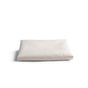 The Naturepedic Fitted Waterproof Crib Mattress Protector Pad, in plain off-white, is neatly folded and displayed on a white background.