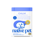 A cylindrical container of Native Pet Calming Supplement for Cats with a blue lid, featuring a line drawing of a curled-up cat, a chicken-flavored treat icon, and text describing ingredients and stress relief.
