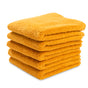 A neatly stacked pile of five folded orange Natemia Organic Super Absorbent Washcloths, made from 100% GOTS Certified Organic Cotton, is displayed against a white background.