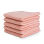 A neatly stacked pile of four folded pink Natemia Organic Super Absorbent Washcloths, made from 100% GOTS Certified Organic Cotton, on a white background.