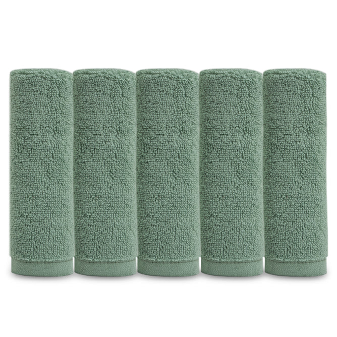 Five Natemia Organic Super Absorbent Washcloths made from 100% GOTS Certified Cotton in sage green are rolled upright in a row against a white background.