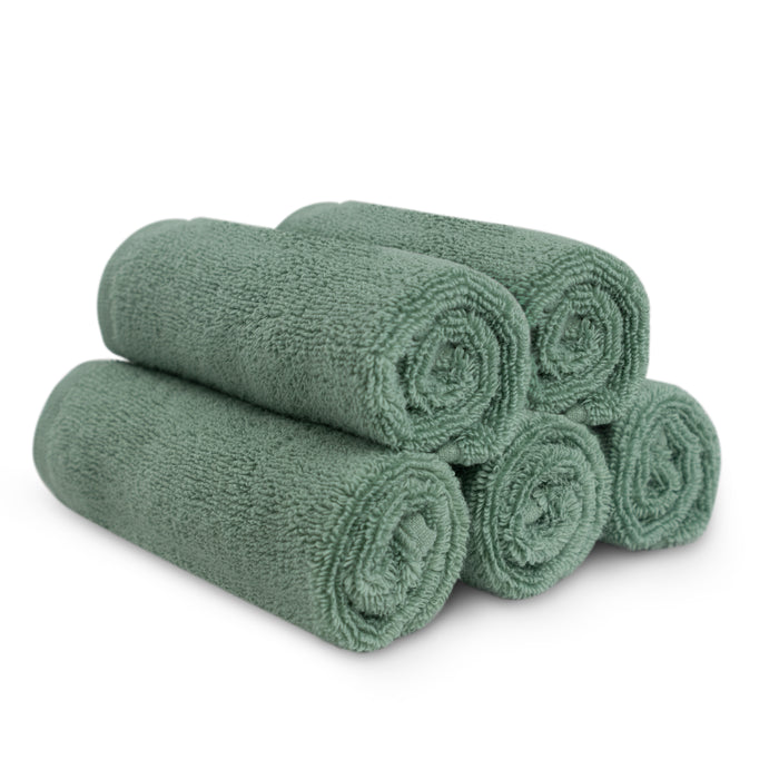 Five Natemia Organic Super Absorbent Washcloths, made from 100% GOTS Certified Organic Cotton, are rolled in green and stacked in a pyramid on a white background.