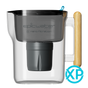 A transparent Nano XP Water Filter Pitcher by Epic Water Filters USA features a black filter labeled “epicwater filters nano filtration” and a wooden handle. This NSF certified pitcher, designed for advanced water filtration—including the reduction of bacteria and PFAS—displays a blue XP logo at the bottom right corner.