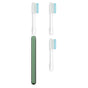 The Nada Soft Adult Toothbrush in green comes with three white replacement brush heads with blue and white bristles and clear caps, helping reduce waste and promote sustainability—all shown on a white background.