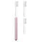 The Nada Medium Adult Toothbrush features a pink electric handle and three white replaceable brush heads with clear covers, designed to help reduce waste and extend your toothbrush’s life.