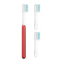 The Nada Soft Kids Toothbrush, in red and white, features an electric handle with two detachable heads—each with white bristles and blue-tipped ends—to help reduce waste, displayed on a clean white background.