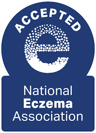A blue badge featuring the word ACCEPTED above a dotted lowercase e, with the text National Eczema Association below.