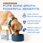 A dog enjoys a meal from a blue bowl beside a can of Native Pet Beef Bone Broth Topper for Dogs. This product adds delicious flavor, promotes joint health with collagen, and boosts hydration when mixed with water—making it an ideal topper for any dog’s meal.