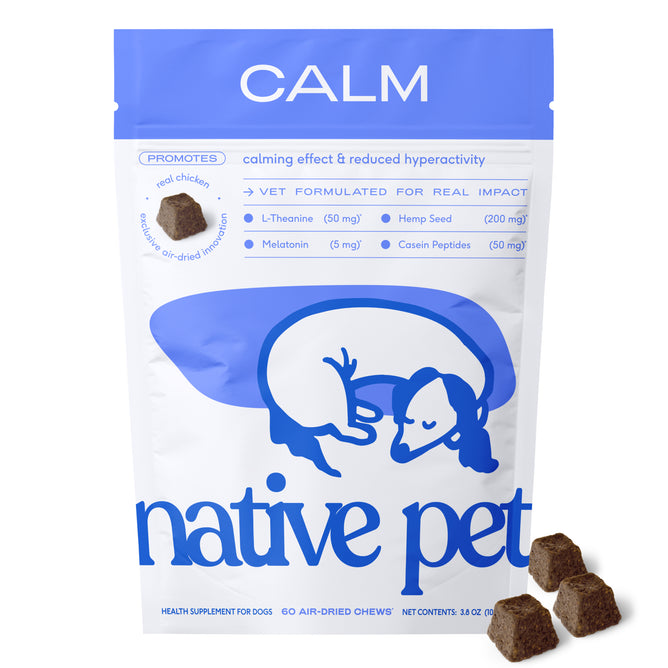 A white bag labeled “Calm” from Native Pet, featuring an illustration of a sleeping dog, contains Native Pet’s Calm Chews Supplement for Dogs—an anxiety supplement—with several brown air-dried chicken chews displayed in front of the bag.