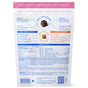 Back of a Native Pet Skin and Coat Chews Supplement for Dogs package displaying ingredients, nutritional facts, and detailed product information. The mostly white packaging with pink and blue accents features a QR code at the bottom. It highlights the benefits of air-dried chews compared to soft chews, emphasizing their effectiveness as dog supplements to support overall health.