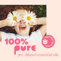 Happy child lying on grass covers their eyes with daisies. Text reads: Plant Therapy No More Warts Roll-On – 100% pure pre-diluted natural essential oil blend, gentle on skin, with a leaf icon.