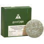 A round, green shampoo bar sits before a box labeled Good Juju Body & Home Nourishing Shampoo Bar for Balanced/Normal Hair, featuring all-natural ingredients like bergamot and eucalyptus.