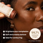 A person applies ATTITUDE’s Oceanly Bronzer to their cheek, highlighting benefits: brightens complexion, soft creamy texture, ideal for contouring, and made with 99.7% natural origin ingredients.