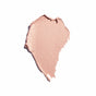 A smear of Oceanly Eyeshadow by ATTITUDE, in a shimmery light pink vegan cream, is unevenly spread on a white background, resembling a makeup swatch.