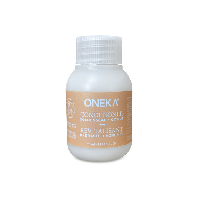 A 75 ml (2.54 fl oz) white plastic bottle of Oneka Conditioner - Goldenseal and Citrus features a beige label with English and French details. This organic, nourishing haircare product comes from the Oneka brand.