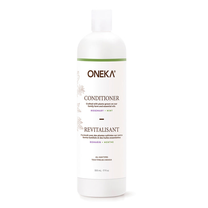 A 500 ml white bottle of Oneka Conditioner - Rosemary & Mint with a green cap and label, hydrates the scalp, is suitable for all hair types, and contains 17 fl oz.