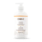 A clear plastic pump bottle labeled “Oneka Body Lotion - Goldenseal and Citrus” with gold accents displays both English and French text. This 16 fl oz (474 ml) organic lotion features deeply hydrating goldenseal, citrus, and ylang ylang.