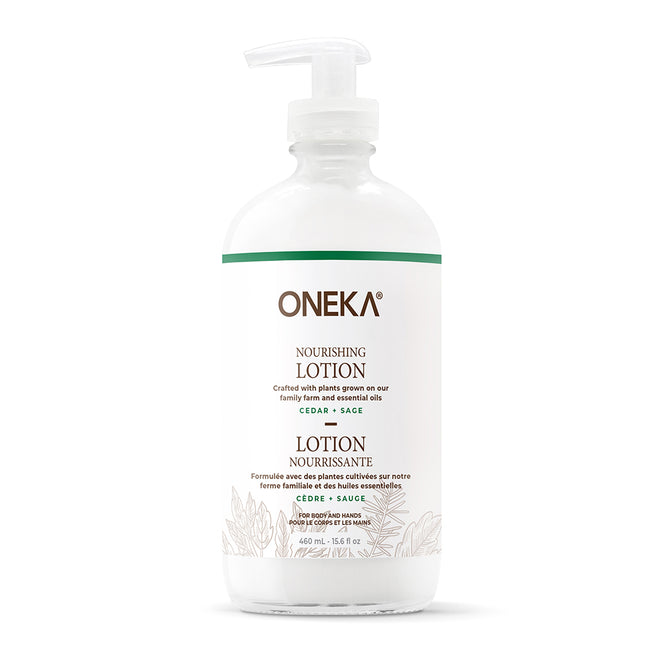 A white pump bottle labeled Oneka Body Lotion - Cedar & Sage features green accents and botanical illustrations. This 16 fl oz (475 mL) lotion hydrates with organic plants and essential oils.
