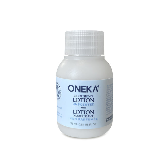 A 75 ml small white plastic bottle of Oneka Body Lotion - Unscented with a white cap; features bilingual text and is made with organic plants—ideal for sensitive skin.