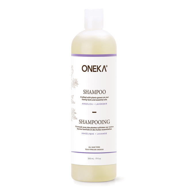 A 500 ml Oneka Shampoo - Angelica and Lavender, an organic haircare essential in a white bottle with botanical illustrations, promotes scalp health and features a convenient flip-top cap.