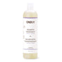 A 500 ml Oneka Shampoo - Angelica and Lavender, an organic haircare essential in a white bottle with botanical illustrations, promotes scalp health and features a convenient flip-top cap.