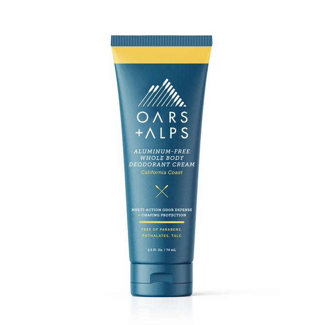 A blue and yellow tube of Oars + Alps Aluminum-Free Whole Body Cream Deodorant, California Coast scent, made with natural starches for moisture absorption and free of parabens, phthalates, and talc.