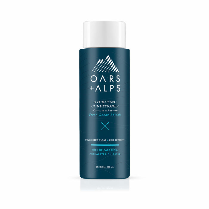 A blue Oars + Alps Hydrating Conditioner bottle labeled “Fresh Ocean Splash.” This sulfate-free formula with algae and kelp extracts delivers intense moisture without parabens or phthalates.