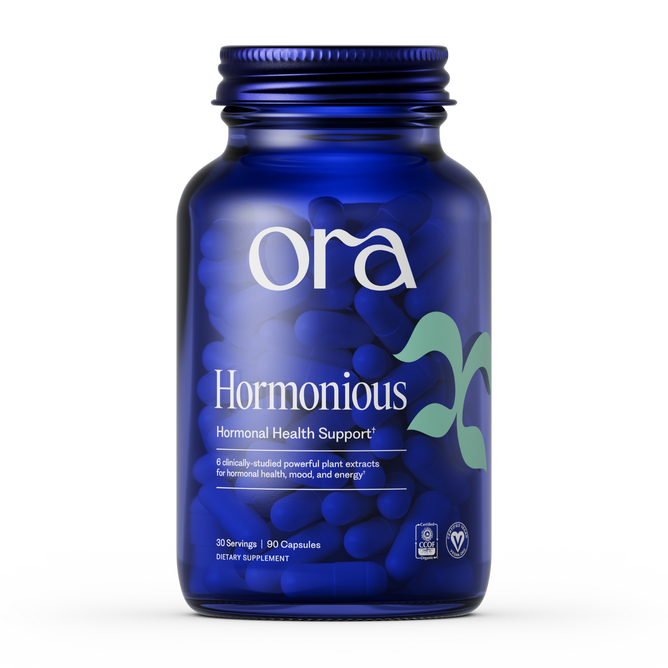 A blue bottle labeled Ora Organic Hormonious: Hormonal Balance & Support Capsules, vegan-certified for hormonal support, mood, and energy; contains 30 servings (90 capsules) with adaptogens to promote optimal wellness.