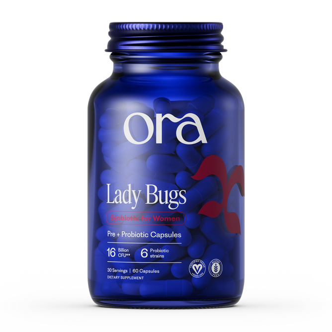 A blue Ora Organic Lady Bugs: Synbiotic for Women bottle has 60 capsules with 16 billion CFU and 6 probiotic strains to support vaginal health, plus several certification icons at the bottom of the label.
