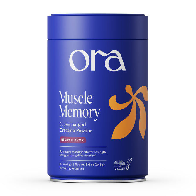 A blue container of Ora Organic Supercharged Creatine Powder - Muscle Memory in berry flavor. The label highlights muscle power, energy, cognitive performance benefits, and confirms it's vegan and not tested on animals.