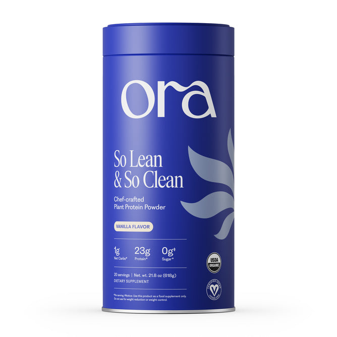 A blue cylindrical container of Ora Organic’s So Lean & So Clean: Daily Active Plant Protein in vanilla flavor, featuring 1g net carbs, 23g protein, 0g sugar, and USDA organic and vegan labels for high-quality nutrition.