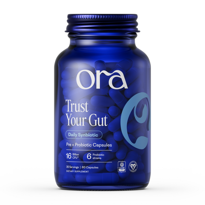 A blue bottle of Ora Organic Trust Your Gut: Daily Pre + Probiotic Capsule holds 60 vegan, non-GMO capsules with 16 billion CFU, 6 probiotic strains, and prebiotics for gut health.