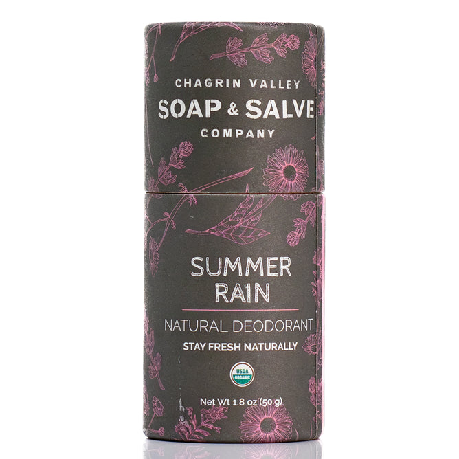 A cylindrical tube of Chagrin Valley Soap & Salve Deodorant Stick, made with natural ingredients and featuring pink botanical designs. The label displays "Stay Fresh Naturally" and the USDA Organic seal.