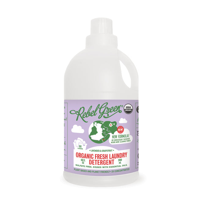 A bottle of Rebel Green Fresh Laundry Detergent Liquid - 3x Concentrated with lavender and grapefruit scent; the purple and white label shows a woman hanging laundry and highlights eco-friendly, gentle ingredients.