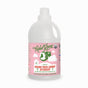 A white bottle of Rebel Green Fresh Laundry Detergent Liquid - 3x Concentrated with a pink label features a green woman hanging laundry. It offers a Pink Lilac scent, gentle ingredients, and is organic and cruelty-free certified.