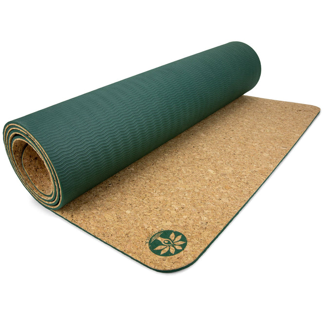 The Yoloha Yoga Original Cork Yoga Mat is a partially unrolled, green yoga mat featuring a distinctive leaf logo in the corner. Crafted from renewable materials, it boasts a non-slip cork underside for enhanced stability.