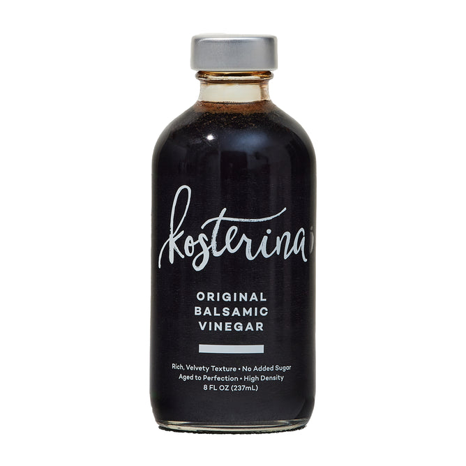 A glass bottle of Kosterina Original Balsamic Vinegar features dark, barrel-aged liquid, a silver cap, and white front text. This Modena balsamic vinegar comes in an 8 fl oz (237 mL) size.