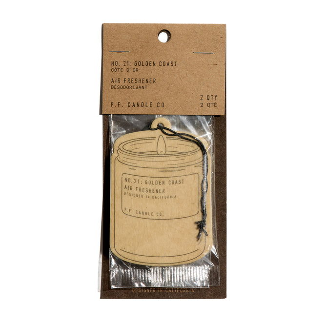 The Car Freshener by P.F. Candle Co. features a standard candle-shape, No. 21: Golden Coast scent, and comes in brown kraft paper packaging with black text, a clear plastic window, and minimal waste.