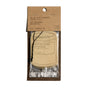 A P.F. Candle Co. Car Freshener, candle-jar shaped, delivers an instant scent boost. Packaged in brown kraft paper and clear plastic with product info on top, two Car Fresheners are visible inside.