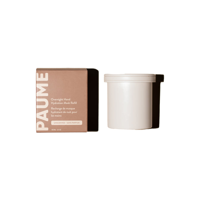 A brown box labeled PAUME Overnight Hand and Foot Hydration Mask Refill stands beside a plain white container with a lid—both designed for dry, cracked skin—set against a white background.