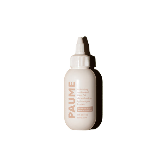 A white PAUME Moisturizing Antibacterial Hand Gel Bottle with a nozzle cap, suitable for sensitive skin, stands upright against a plain white background.
