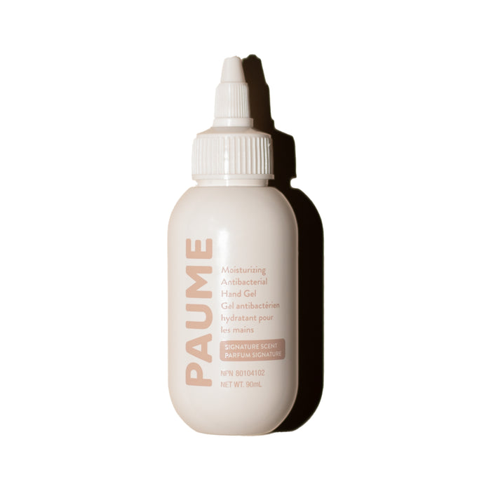 A white PAUME Moisturizing Antibacterial Hand Gel Bottle with a nozzle cap, suitable for sensitive skin, stands upright against a plain white background.