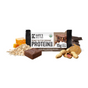 A Kates Real Food Organic Protein Bar - Peanut Butter Brownie is shown with its packaging, oats, honeycomb, brownie, chocolate, peanut butter, and peanuts. This gluten-free bar is naturally sweetened and offers 15g plant protein.