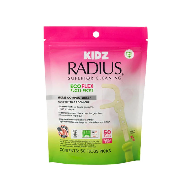 A pink and white package of Radius Kids EcoFlex™ Refill Bag, labeled for superior cleaning, containing 50 home compostable floss picks for children. The packaging highlights these kids’ floss picks as an eco-friendly choice, featuring an image of the floss pick and displaying various eco-friendly certifications.