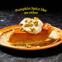 A slice of pumpkin pie topped with whipped cream and chopped nuts on a ceramic plate, made extraordinary with Diaspora Spice Co.’s Pumpkin Spice Blend. Text above reads, Pumpkin Spice like no other.