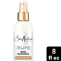 A bottle of SheaMoisture 100% Virgin Coconut Oil Leave in Treatment, 8 fl oz, featuring a gold spray cap and a white label on a white background—ideal for nourishing your hair and making detangling effortless with each spray.
