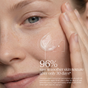 A close-up of a person applying Resurfacing Overnight Glycolic Serum by Andalou Naturals to their cheek, highlighting smooth skin. Text reads: “96% saw smoother skin texture after only 30 days*” with additional study details below.